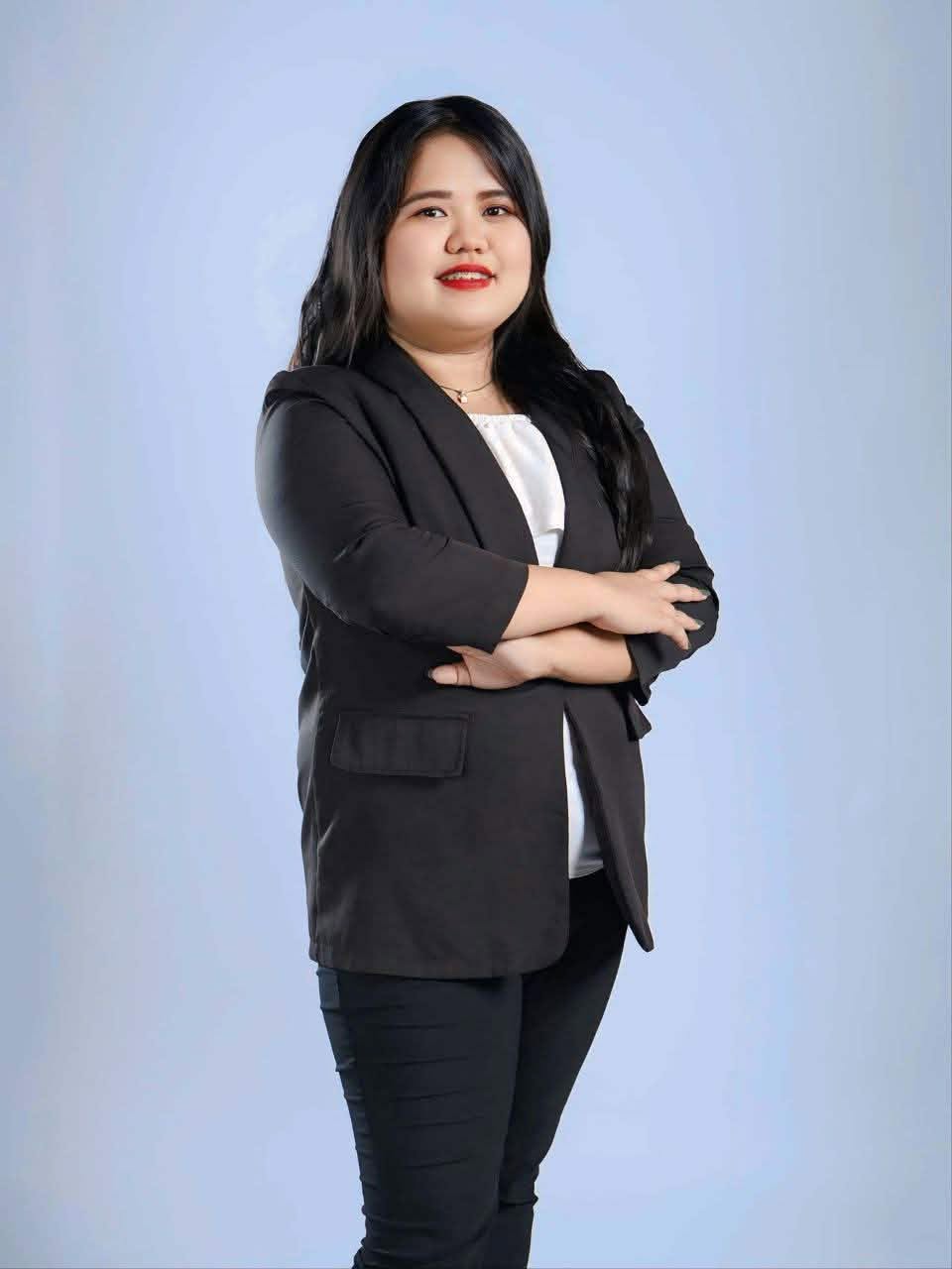 Mia Francheska Villalarbo in a black blazer, arms crossed